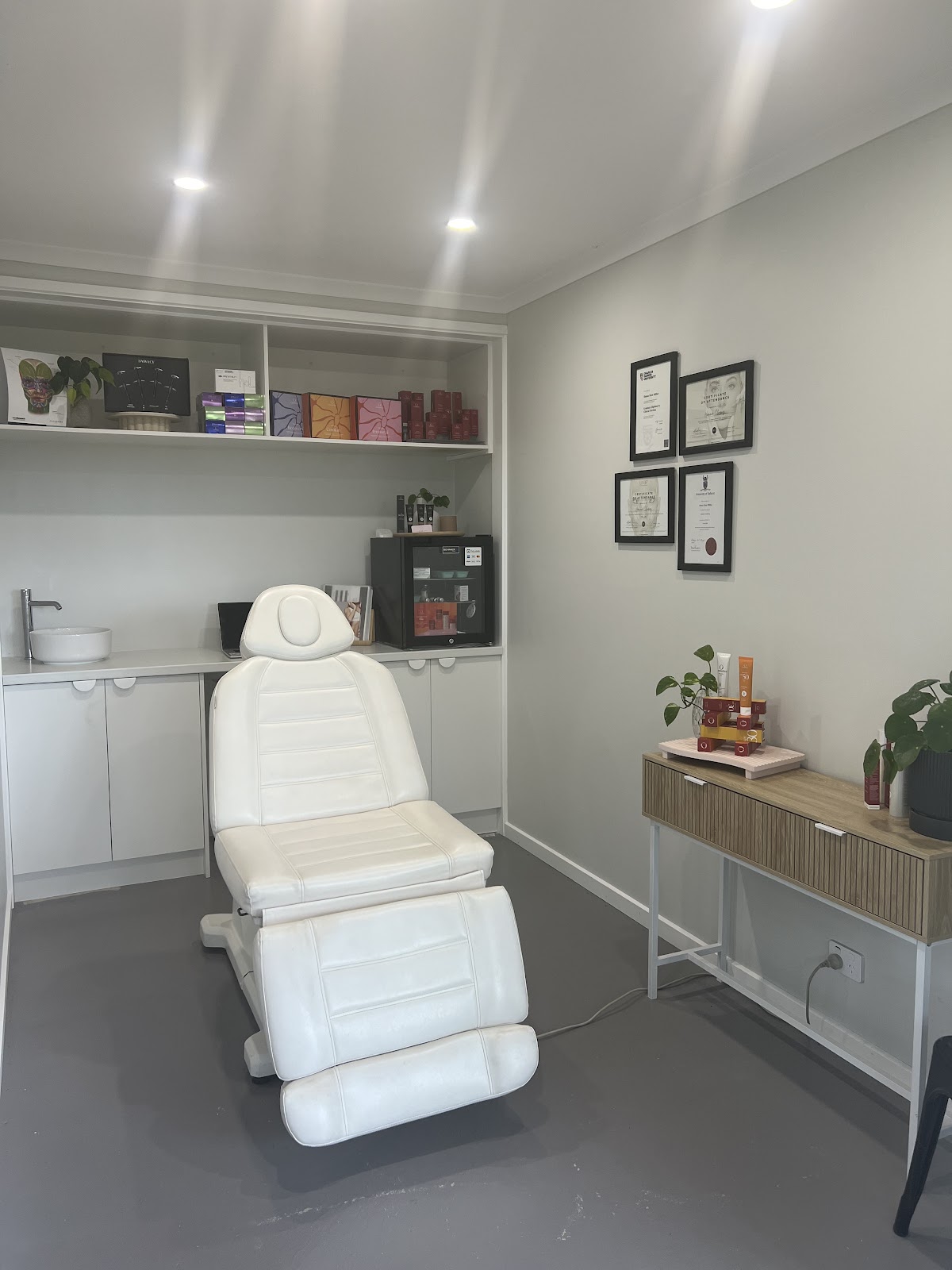 The treatment bed and desk inside the Skin By Her room